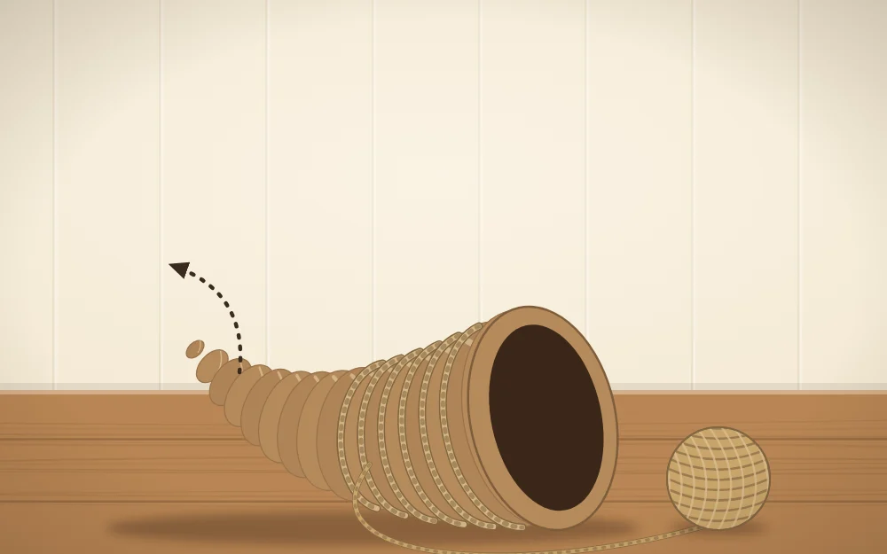 A paper cone with its narrow tip bent into a gentle upward curve and twine wrapped around it