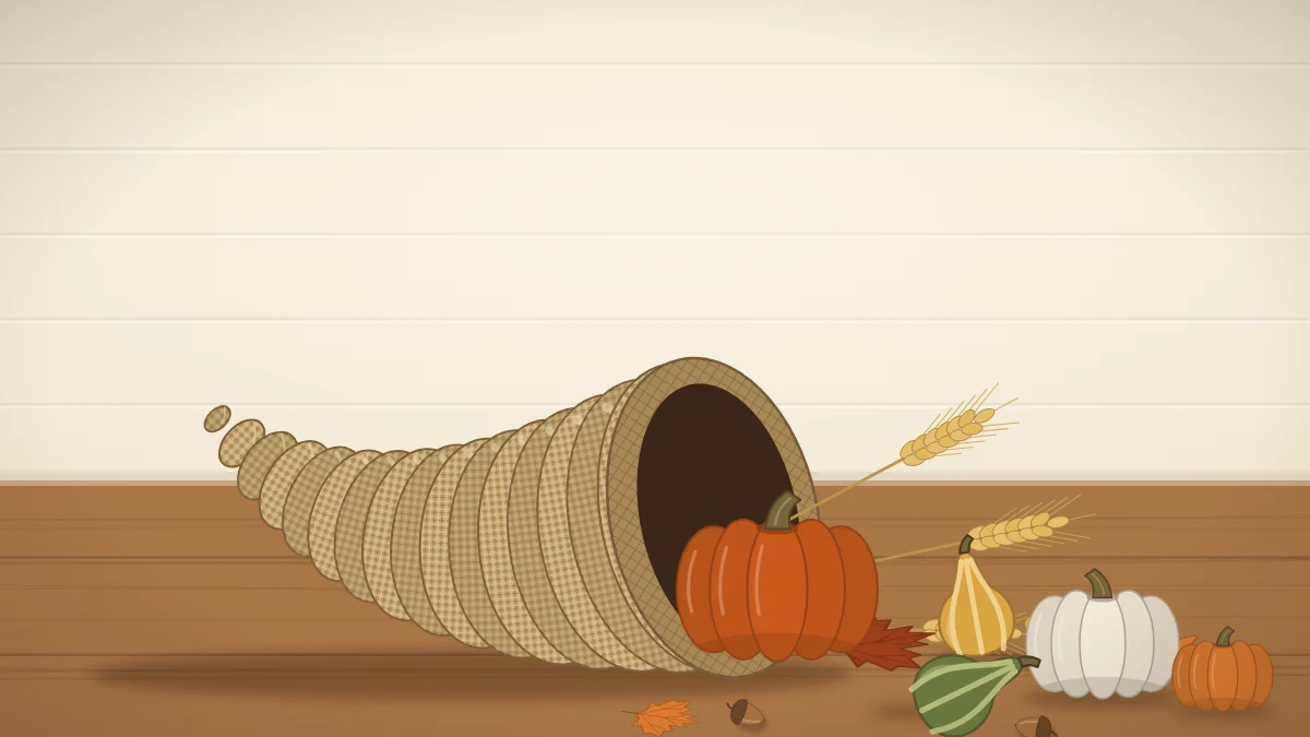 A burlap-wrapped horn-shaped basket on its side with mini pumpkins, gourds, wheat stems and leaves spilling onto a table