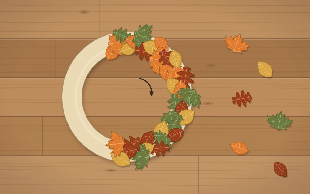 A ring partly covered with overlapping leaves all pointing the same direction, with loose leaves waiting beside it