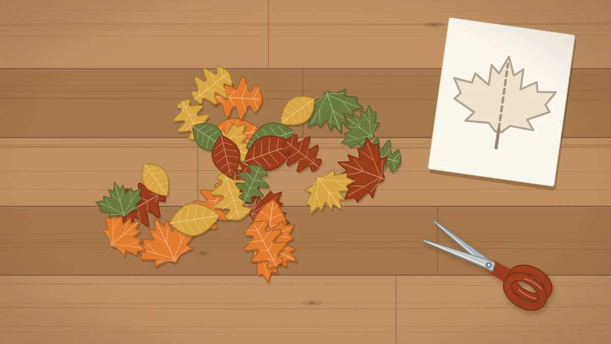A pile of cut felt leaves in orange, mustard, rust and olive beside scissors and a paper template