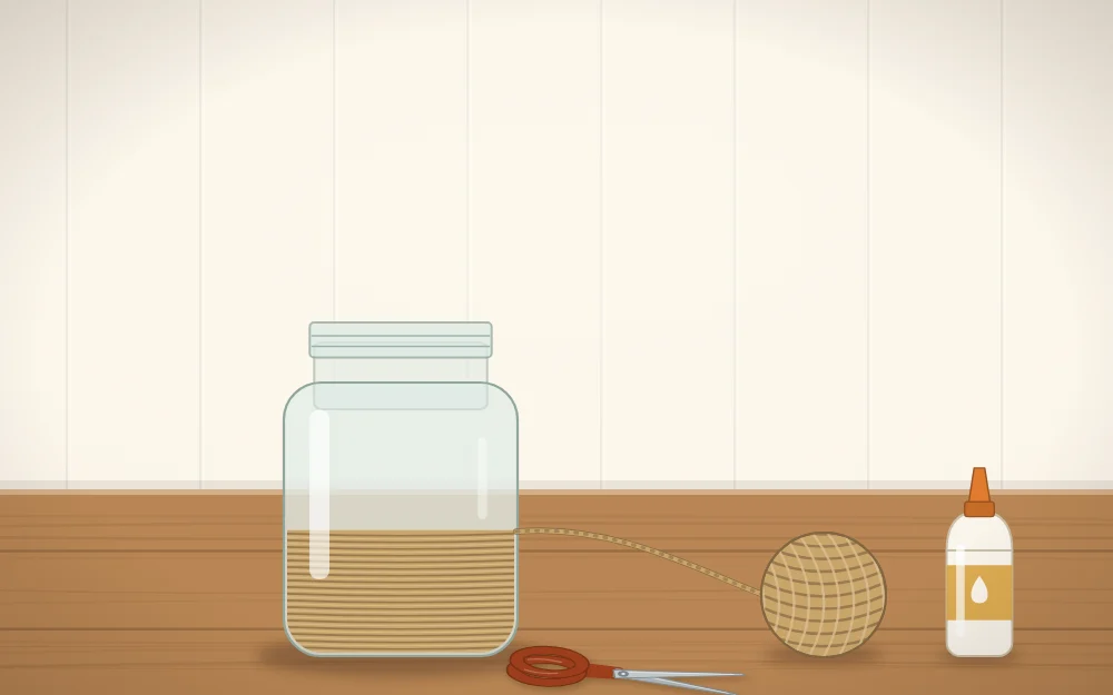 A jar being wrapped with twine from the bottom up, with a glue bottle and scissors beside it